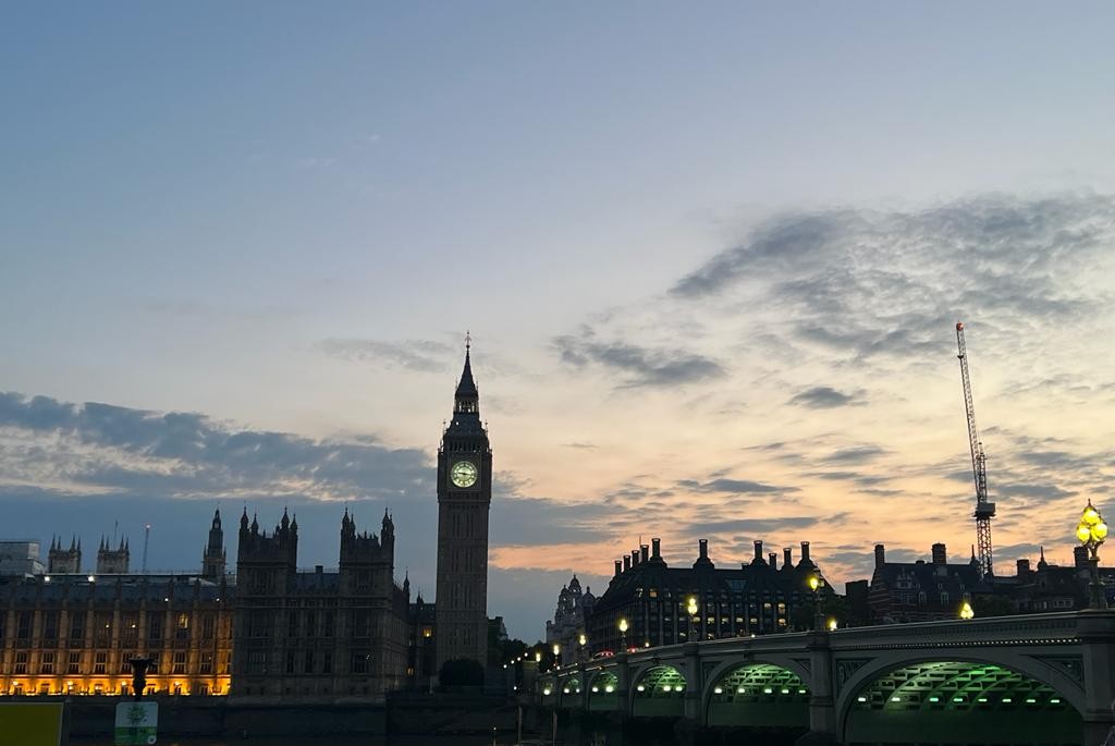 Photo taken of Big Ben across Westminster Bridge at sunset. Taken landscape to show more of the surroundings.